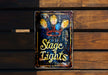 a sign on a wooden wall that says stage lights
