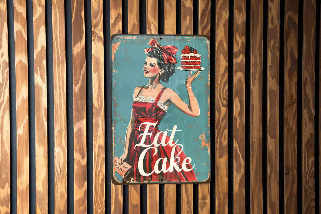 a sign on a wooden wall that says eat cake