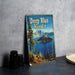 a book sitting on a table next to a pair of binoculars