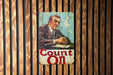 a sign on a wooden wall that says count on