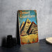 a book sitting on top of a table next to a plate