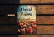 a sign on a wooden bench that says floral views