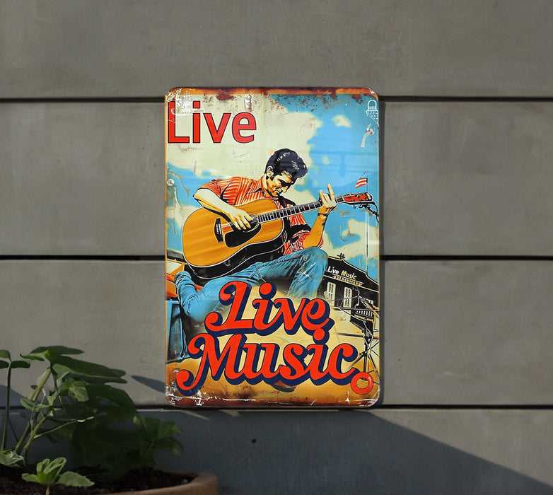 a metal sign with a man playing a guitar