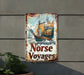 a rusted sign that says norse voyages on it