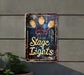 a sign on a wall that says stage lights