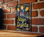 a sign on a brick wall that says stage lights