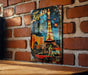 a picture of the eiffel tower on a brick wall