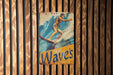 a picture of a man riding a surfboard on a wooden wall