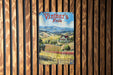 a painting of a farm scene on a wooden fence