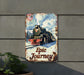 a metal sign with a train on it