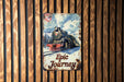 a painting of a train on a wooden wall
