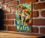 a sign on a brick wall that says wild watch