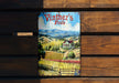 a book sitting on top of a wooden bench