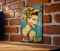 a picture of a woman on a brick wall