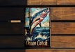 a picture of a fish on a wooden wall