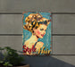 a metal sign with a woman's hair on it