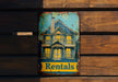 a sign on a wooden wall that says rentals