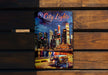 a picture of a city lights book on a bench