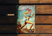 a metal sign with a woman running on it