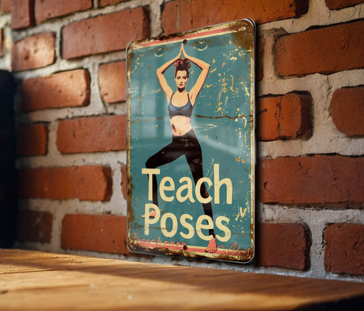 a sign that says teach poses on a brick wall