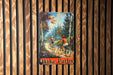 a painting of two people riding bikes on a wooden wall