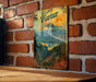 a wooden table with a poster on a brick wall