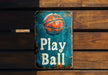 a sign that says play ball on it