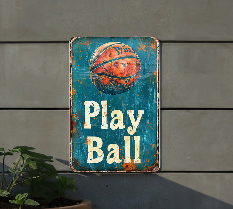 a sign that says play ball hanging on a wall