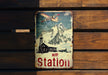 a metal sign on a wooden wall that says ice station