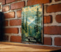 a picture hanging on a brick wall next to a wooden table