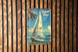 a picture of a sailboat on a wooden wall