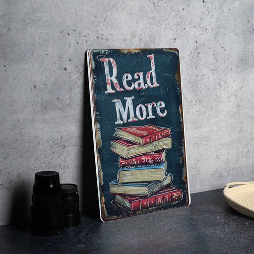 a sign with a stack of books on top of it