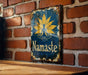 a sign on a brick wall that says namaste