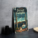 a book sitting on top of a table next to a plate