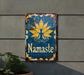 a sign on a wall that says namaste