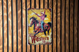 a western rodeo sign hanging on a wooden wall