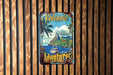 a wooden wall with a sign that says volcano adventures