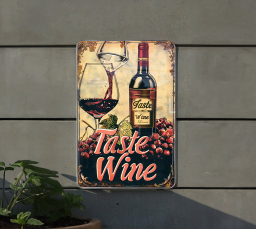 a metal sign with a bottle of wine and a glass of wine