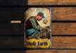 a sign on a wooden wall that says study earth