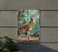 a sign on the side of a building that says protect nature