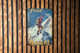 a sign on a wooden wall that says peak ascent