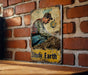 a picture of a man sitting on a bench next to a brick wall