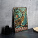 a picture of a deer and a bird on a table