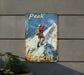 a sign on the side of a building that says peak ascent