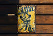 a metal sign with a baseball player holding a bat