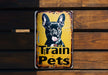 a sign that says train pets with a picture of a dog
