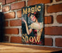 a sign on a brick wall advertising a show