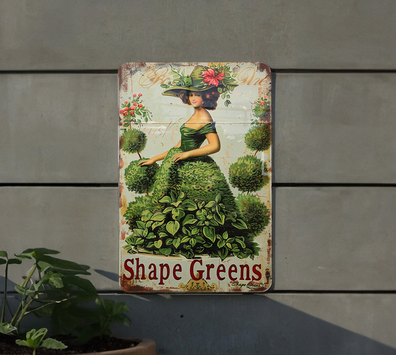 a picture of a woman in a green dress