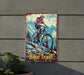 a bicycle trail sign hanging on the side of a building