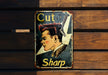 a sign on a wooden bench that says cut sharp